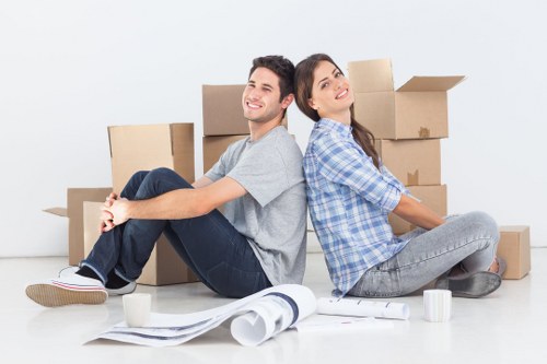 Workers using safe lifting methods during a removals job