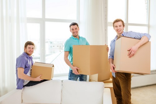 Furniture and household items being loaded into a van