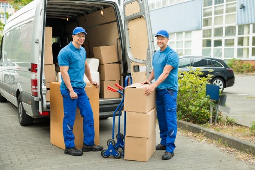 Local moving team navigating residential streets in Ilford