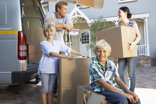 Furniture and boxes being loaded into a van in Ilford