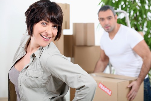 Careful unloading of boxes and furniture at a new Ilford home