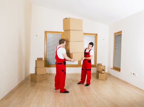 Removal crew loading office items for a move in Ilford